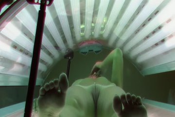 Skinny blonde enjoys tanning session